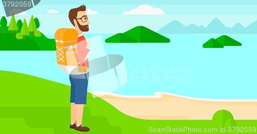 Image of Man with backpack hiking.