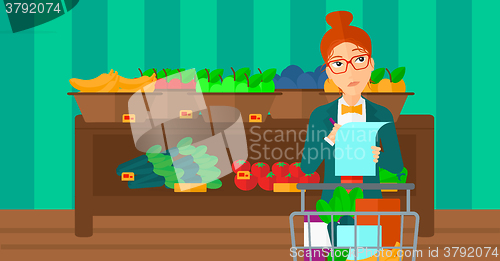 Image of Woman with shopping list. 