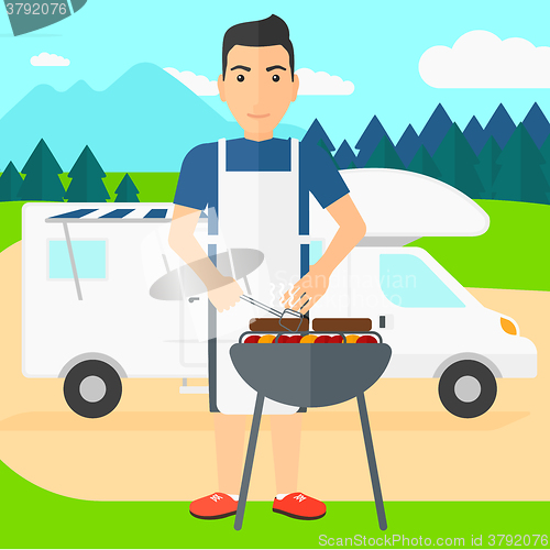 Image of Man preparing barbecue.