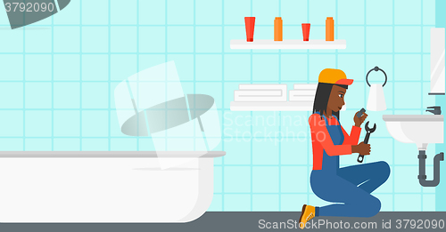 Image of Woman repairing sink.