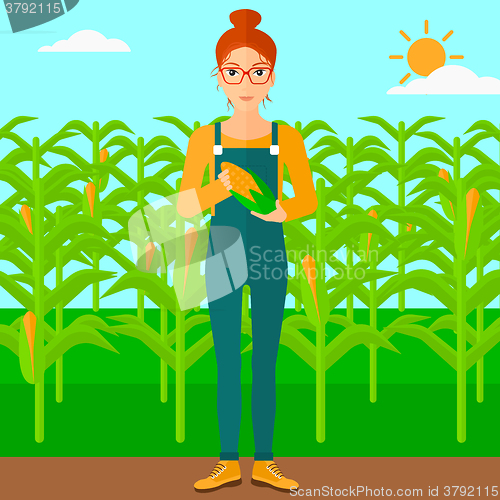 Image of Farmer holding corn.
