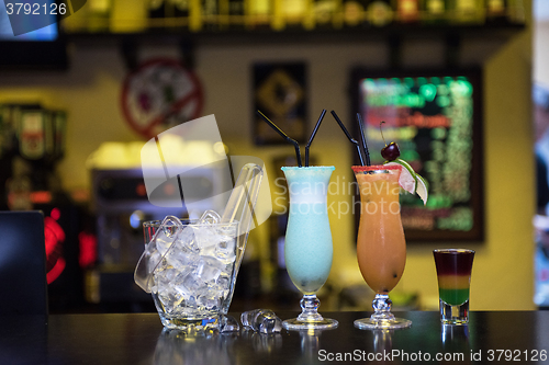 Image of cocktails on bar background