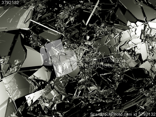 Image of Pieces of Shattered glass on black background