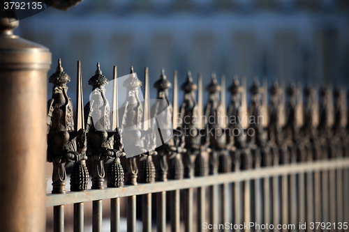 Image of metal fence with peaks