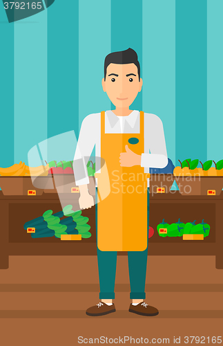 Image of Friendly supermarket worker.