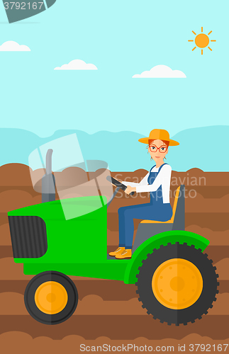 Image of Farmer driving tractor.