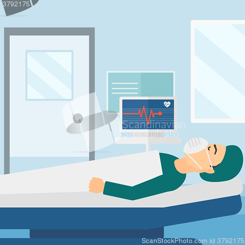 Image of Patient lying in hospital  bed with heart monitor.