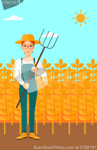 Image of Farmer with pitchfork.