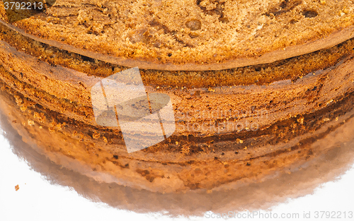 Image of Closeup of freshly made chocolate cake base on silver mirror pla