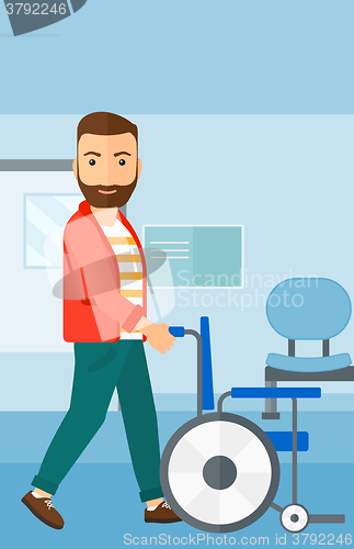 Image of Man pushing wheelchair.