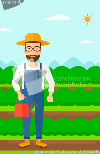 Image of Farmer with watering can.