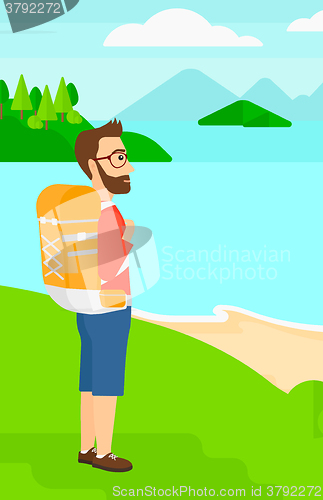 Image of Man with backpack hiking.