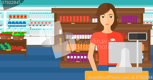 Image of Saleslady standing at checkout.