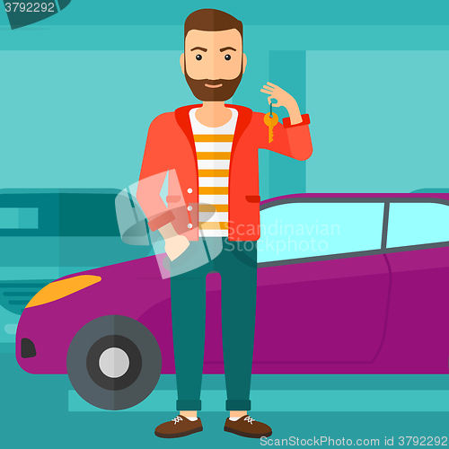 Image of Man holding keys from new car.
