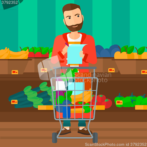 Image of Man with shopping list. 