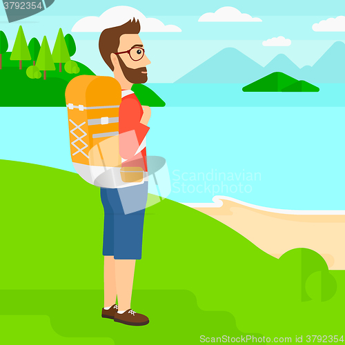 Image of Man with backpack hiking.