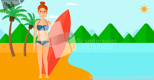 Image of Surfer holding surfboard.