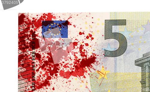 Image of Close-up of a 5 euro bank note, stained with blood