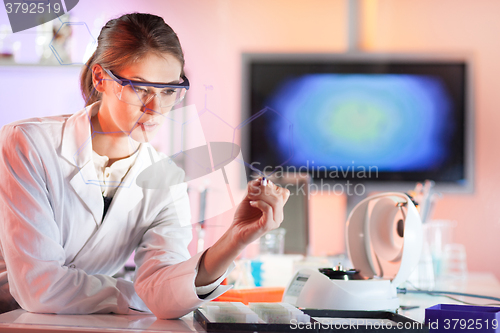 Image of Life science researcher working in laboratory.