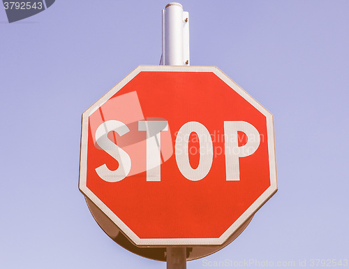 Image of  Stop sign over blue sky vintage