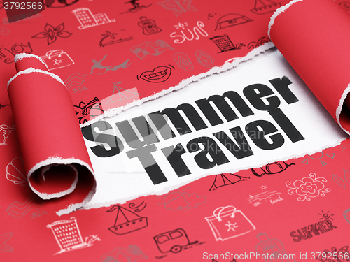 Image of Travel concept: black text Summer Travel under the piece of  torn paper
