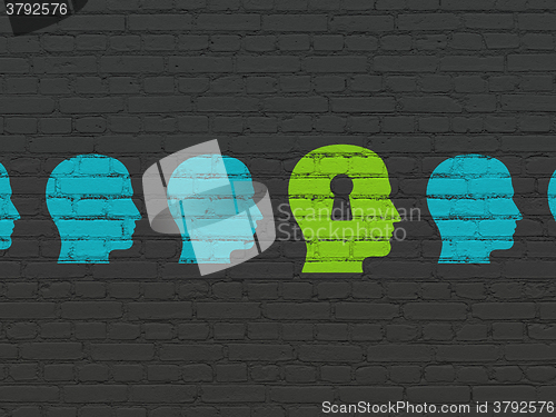 Image of Finance concept: head with keyhole icon on wall background