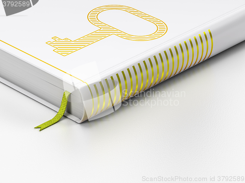 Image of Safety concept: closed book, Key on white background