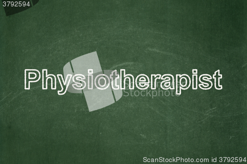 Image of Healthcare concept: Physiotherapist on chalkboard background