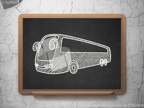 Image of Tourism concept: Bus on chalkboard background