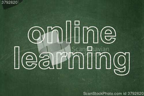 Image of Education concept: Online Learning on chalkboard background