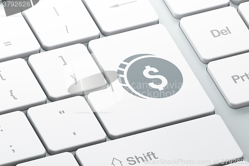 Image of Money concept: Dollar Coin on computer keyboard background