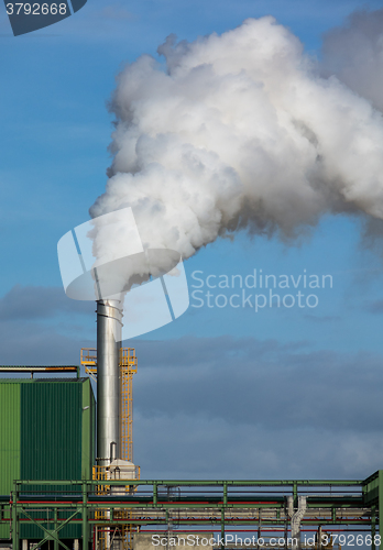 Image of Steaming Pipe on Blue Sky Background