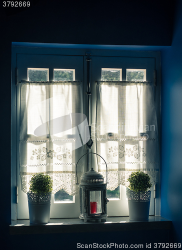 Image of Vintage Window and Curtain with Flower Pots and Old Lamp