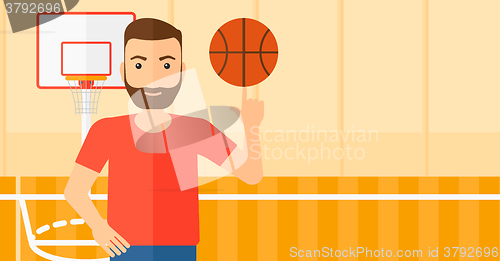 Image of Basketball player spinning ball.