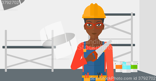 Image of Smiling worker with saw.