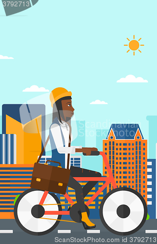Image of Woman cycling to work.