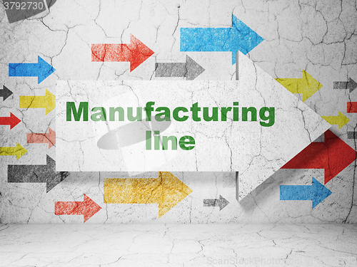 Image of Industry concept: arrow with Manufacturing Line on grunge wall background