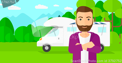 Image of Man standing in front of motor home.