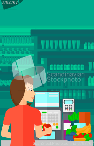 Image of Cashier at supermarket checkout.