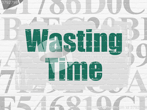 Image of Timeline concept: Wasting Time on wall background