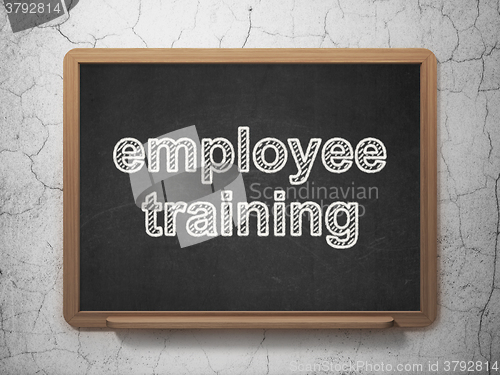 Image of Education concept: Employee Training on chalkboard background