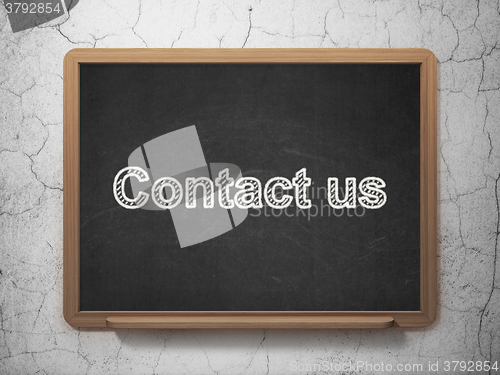 Image of Business concept: Contact us on chalkboard background