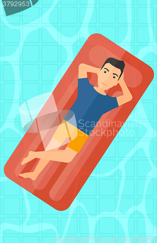 Image of Man relaxing in swimming pool.