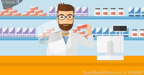 Image of Pharmacist showing some medicine.