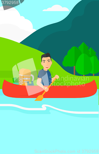 Image of Man canoeing on the river.