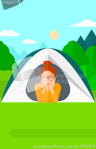 Image of Woman lying in tent.