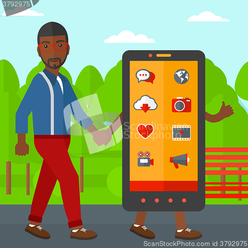 Image of Man walking with smartphone.