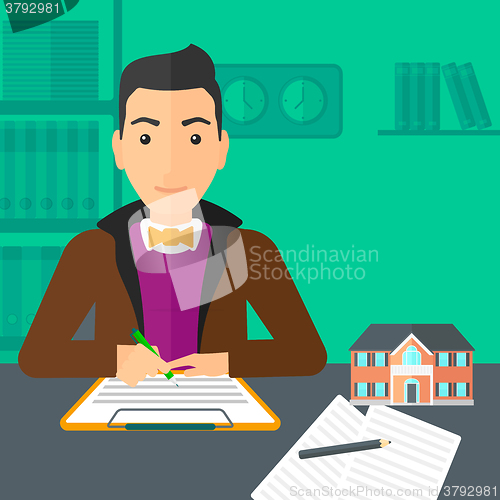 Image of Real estate agent signing contract.