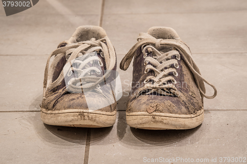 Image of Shoes covered with mud