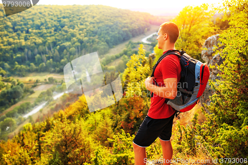 Image of Active tourist on the top of mountain enjoying landscape